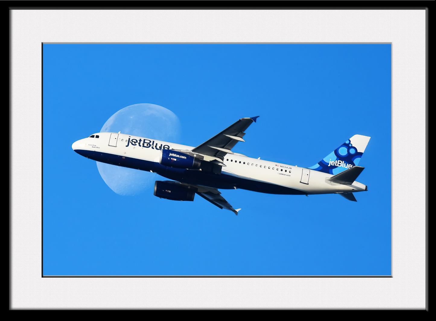 JetBlue in front of Moon