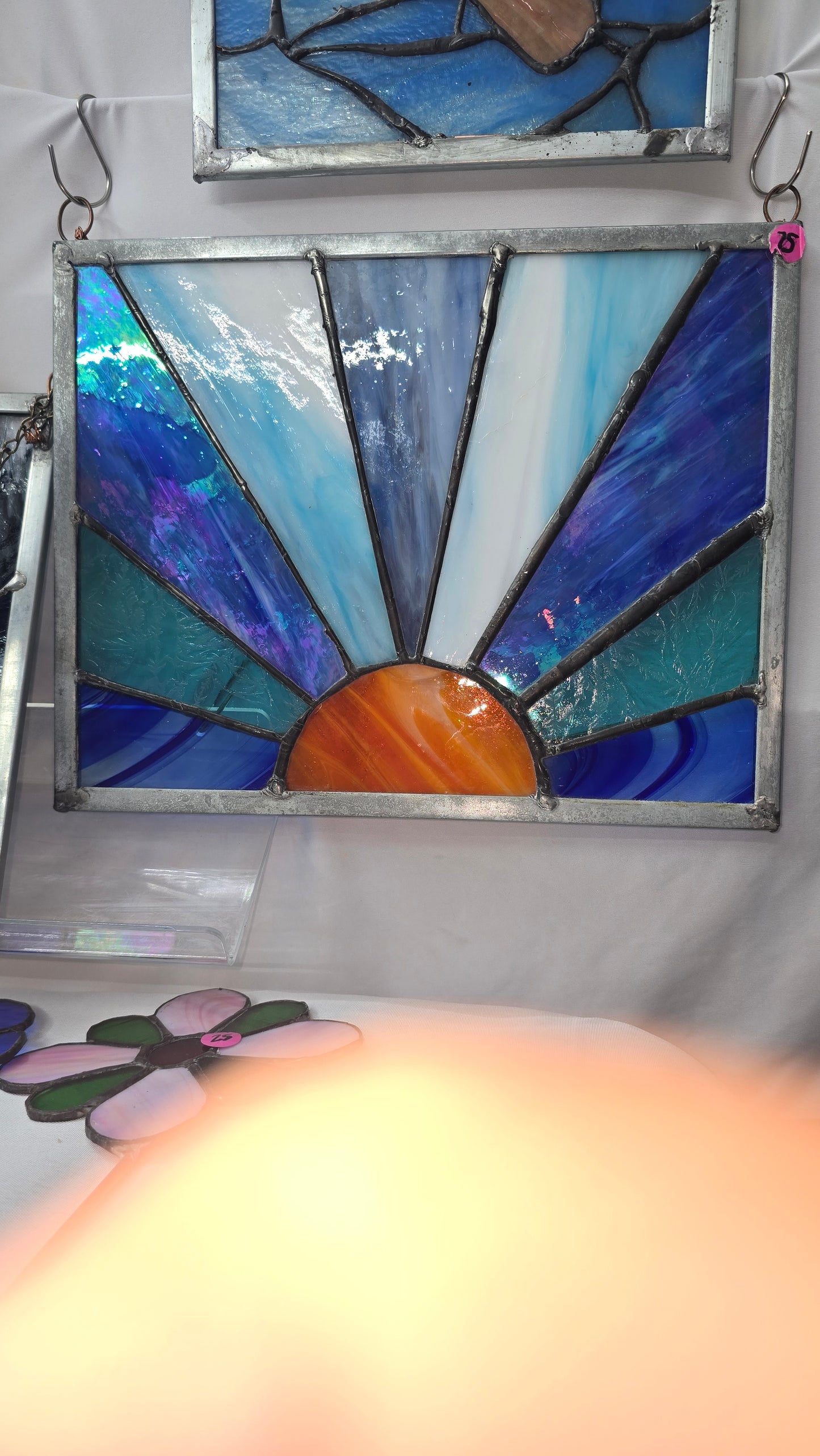 Orange sun with blue rays